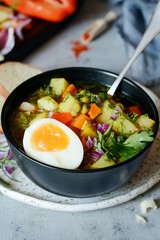 A bowl of delicious Italian vegetable soup Minestrone. Selective focus.