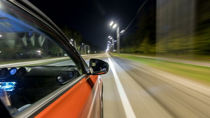 Obraz na płótnie Canvas Drivelapse from Side of Car moving on a night highway timelapse hyperlapse