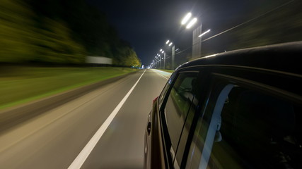 Drivelapse from Side of Car moving on a night highway timelapse hyperlapse