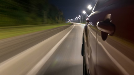 Fototapeta na wymiar Drivelapse from Side of Car moving on a night highway timelapse hyperlapse