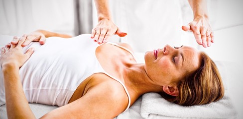 Woman receiving reiki treatment