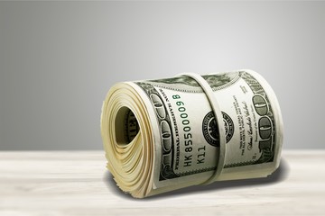 Dollar roll tightened with band. Rolled money