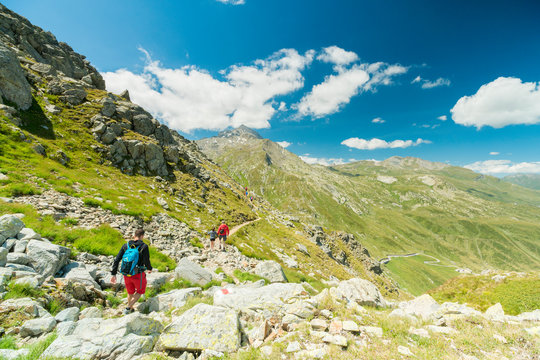 Hikers on footpath towards Pizzo Tambo, Spluga Pass, canton of Graubunden