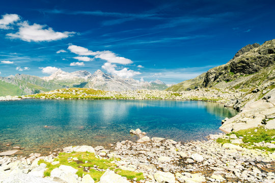 Turquoise crystalline water of lake Bergsee, Spluga Pass, canton of Graubunden