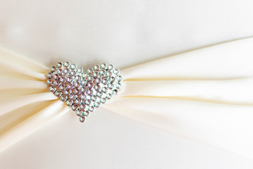 metallic heart shape with bow tie
