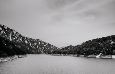 Scenic Kurobe dam, lake and mountain on cloudy day, Toyama - Japan