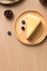 lemon cheese cake display on wooden plate