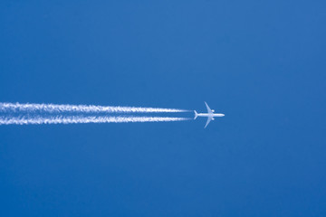 Airplane big two engines aviation airport contrail clouds. Travel trip concept.
