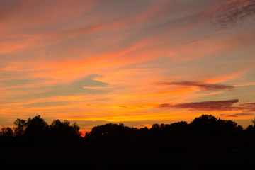 Fototapeta na wymiar dark sunset with crimson clouds