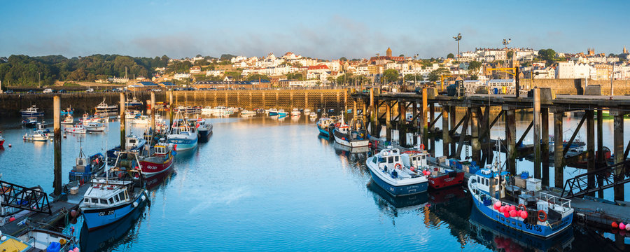 Boats in St. Peter Port Harbour at sunrise, Guernsey, Channel Islands