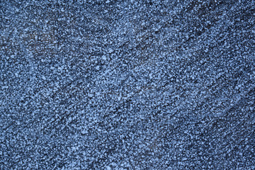 Abstract gray background.Frost on the wooden stump.