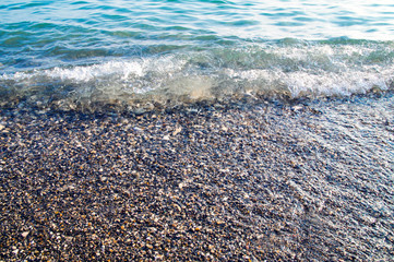 Black Sea, a wave washes the shore of pebbles.