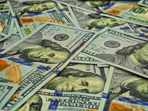 Lot of one hundred dollar bills close-up background
