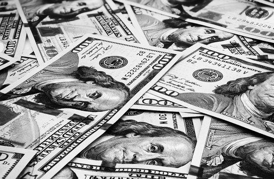 Lot of one hundred dollar bills close-up background