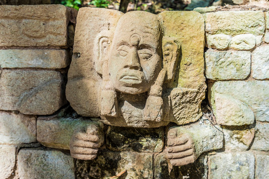 A carved face on a wall from Structure 29 in the Copan Ruins, Copan, Honduras