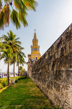 The colourful clock tower (torre del reloj) along the ancient city walls in Cartagena de Indias, Colombia
