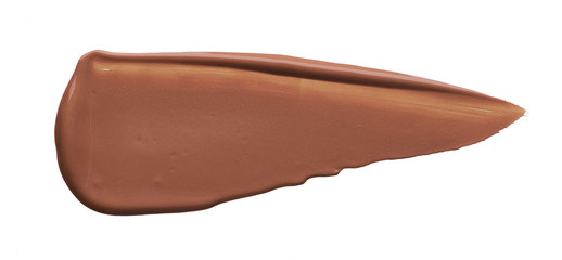 Light beige makeup smear of creamy foundation