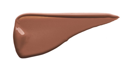 Light beige makeup smear of creamy foundation