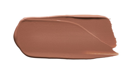 Light beige makeup smear of creamy foundation