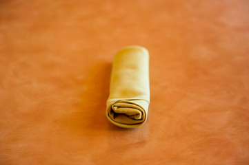 Golden napkin fold use in restaurant.