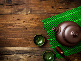 Green japanese tea on wooden table. Top view with copy space