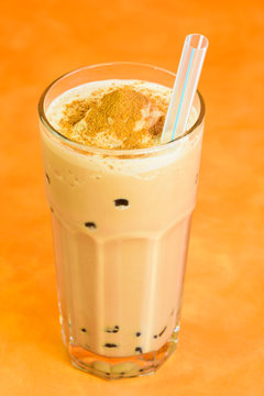 Chocolate milk Boba tea with tapioca balls.