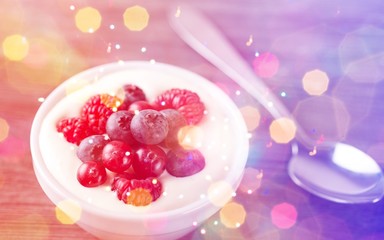 Yogurt with forest berries  on wooden table