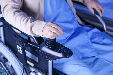 Asian senior or elderly old lady woman patient on electric wheelchair with remote control at nursing hospital ward : healthy strong medical concept 