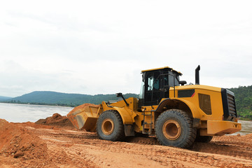 Excavators filled with earth works in Asia
