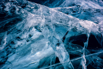 Blue cracked surface of the ice surface