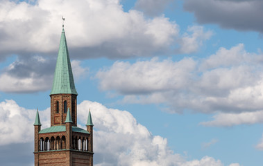Tower of Neo-Romanesque St. Matthew Church Against A Blue Cloudy Sky In Berlin, Germany