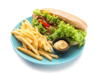 Plate with french fries and tasty hot dog on white background