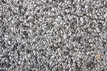 Rough unpolished grey terrazzo surface texture detail close up