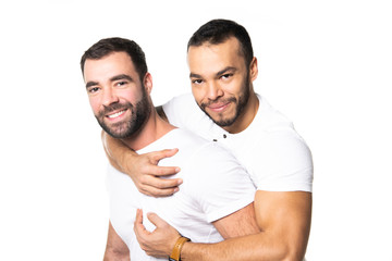 Young homosexuals gay couple love each other on a white background.