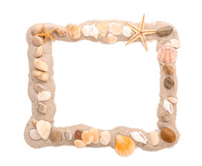 Frame made of sand, sea pebbles and shells on white background