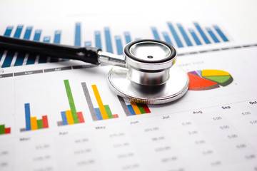 Stethoscope, Charts and Graphs spreadsheet paper, Finance, Account, Statistics, Investment, Analytic research data economy spreadsheet and Business company concept.