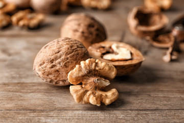 Tasty walnuts on wooden table