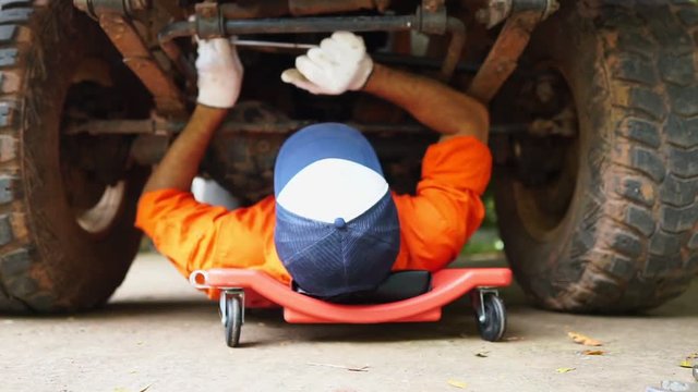 Technicians are working by doing a preliminary inspection of wheel system footage slow motion