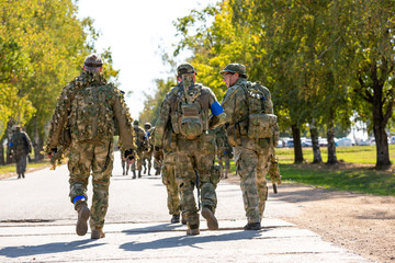 group of soldiers on the Outdoor on army exercises. war, army, technology and people concept