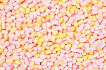 Marshmallow. Background of pink and yellow colorful mini marshmallows.