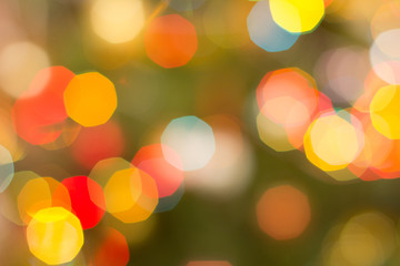 Christmas blurred background with colorful festive lights.