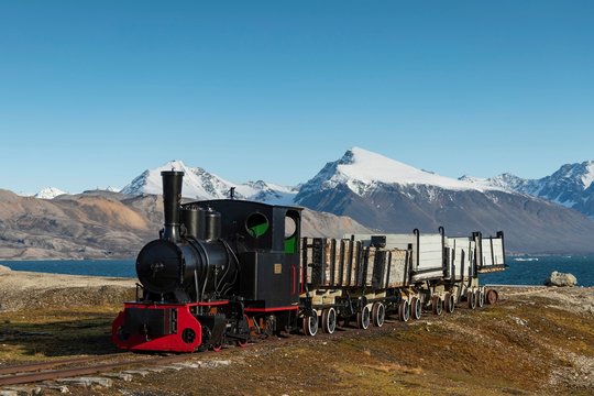 Historic mine train in front of the Kongsfjorden, Ny-Alesund, Spitsbergen, Svalbard Islands, Svalbard and Jan Mayen, Norway, Europe