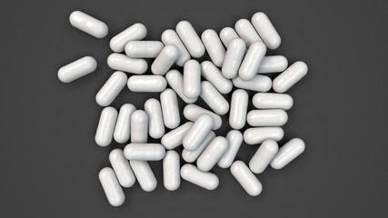Pile of white medicine capsules