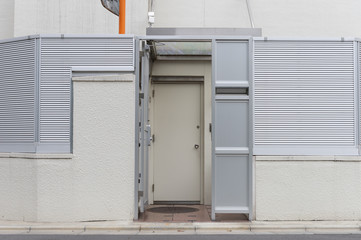 Fototapeta premium sidewalk by street wall & door