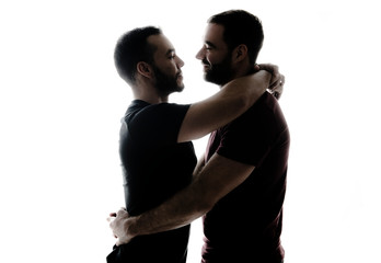 Young homosexuals shadow couple love each other on a white background.