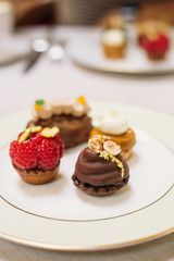Different Kind of Small Cakes on the Plate, Traditional English Tea Ceremony in Luxury Hotel