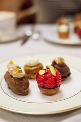 Different Kind of Small Cakes on the Plate, Traditional English Tea Ceremony in Luxury Hotel