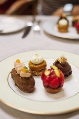 Different Kind of Small Cakes on the Plate, Traditional English Tea Ceremony in Luxury Hotel