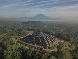 Misty morning of Borobudur ancient temple and Mount Merapi in East Java, Indonesia