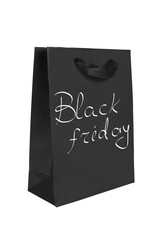 Black paper package with the words Black friday.discount period in shops